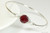 Sterling silver wire wrapped bangle bracelet with garnet red siam crystal handmade by Jessica Luu Jewelry
