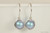 Sterling silver wire wrapped iridescent light blue pearl drop earrings handmade by Jessica Luu Jewelry