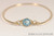 14k yellow gold filled wire wrapped bangle bracelet with aquamarine blue crystal handmade by Jessica Luu Jewelry