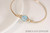 14k yellow gold filled wire wrapped bangle bracelet with aquamarine blue crystal handmade by Jessica Luu Jewelry