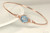 14k rose gold filled wire wrapped bangle bracelet with aquamarine blue crystal handmade by Jessica Luu Jewelry