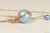 14k rose gold filled wire wrapped iridescent light blue pearl solitaire pendant on chain necklace handmade by Jessica Luu Jewelry