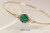 14k yellow gold filled wire wrapped bangle bracelet with emerald green crystal handmade by Jessica Luu Jewelry