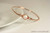 Handmade 14k rose gold filled wire wrapped pearlescent white pearl bangle bracelet