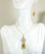 Amber teardrop pendant necklace and earrings set handmade by Jessica Luu Jewelry