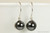 Sterling silver wire wrapped black pearl drop earrings handmade by Jessica Luu Jewelry