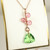 14K rose gold filled wire wrapped pendant with light pink crystals and peridot green trilliant cut Austrian crystal on 18 inch chain necklace handmade by Jessica Luu Jewelry