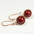 14K rose gold filled dangle earrings with 10mm dark red burgundy pearls handmade by Jessica Luu Jewelry