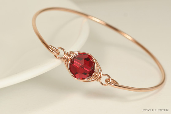 14k rose gold filled wire wrapped bangle bracelet with scarlet red crystal handmade by Jessica Luu Jewelry