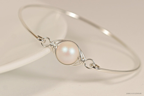 Handmade sterling silver wire wrapped bangle bracelet with pearlescent white pearl