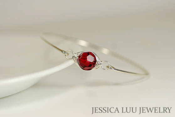 Sterling silver wire wrapped bangle bracelet with scarlet red crystal handmade by Jessica Luu Jewelry