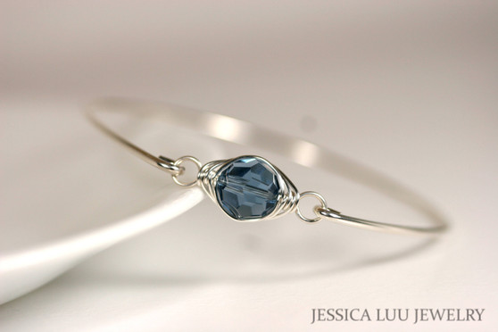 Sterling silver wire wrapped bangle bracelet with denim blue crystal handmade by Jessica Luu Jewelry