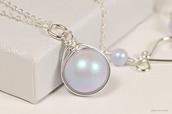 Sterling silver wire wrapped iridescent light dreamy blue pearl solitaire pendant on chain necklace handmade by Jessica Luu Jewelry