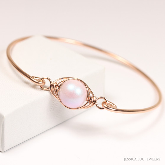 10mm iridescent light pink pearl bangle bracelet in 14K rose gold filled wire wrapped setting handmade by Jessica Luu Jewelry