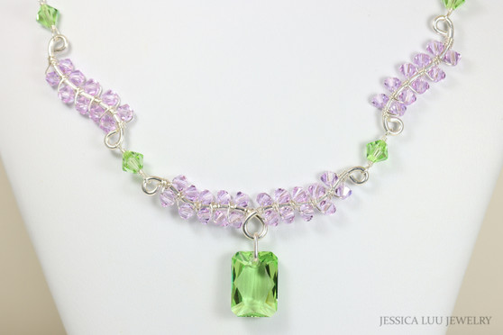 Sterling silver wire wrapped necklace with peridot light green and lavender light purple crystals handmade by Jessica Luu Jewelry