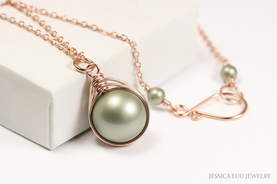 12mm sage green pearl solitaire pendant wrapped in 14K rose gold filled wire and hung on 18 inch long chain necklace handmade by Jessica Luu Jewelry