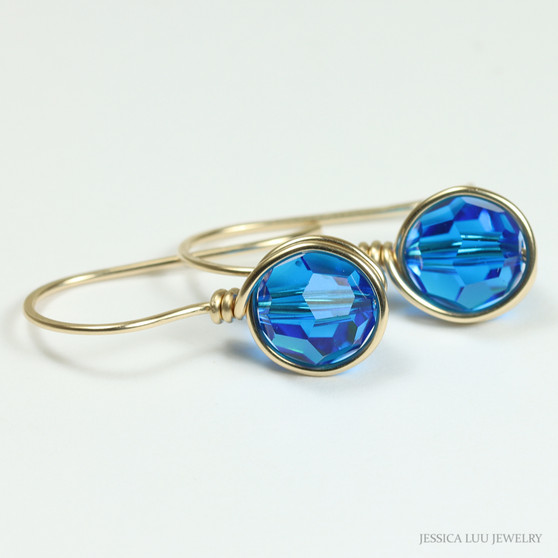 8mm faceted round bright blue Austrian crystal earrings in 14K yellow gold filled wire wrapped setting handmade by Jessica Luu Jewelry