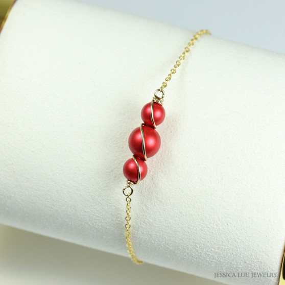 6mm and 8mm red pearls in 14K yellow gold filled wire wrapped setting on chain bracelet handmade by Jessica Luu Jewelry