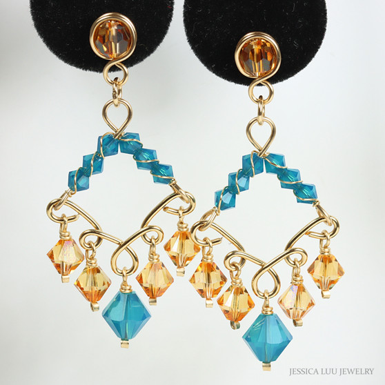 14K yellow gold filled chandelier earrings with blue and orange faceted Austrian crystals handmade by Jessica Luu Jewelry