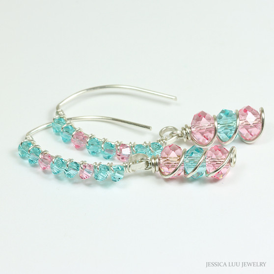 Sterling silver earrings with light pink and blue green Austrian crystal dangles and tiny crystals crusting the long hook ear wires handmade by Jessica Luu Jewelry
