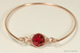 14k rose gold filled wire wrapped bangle bracelet with scarlet red crystal handmade by Jessica Luu Jewelry