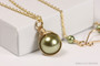 14K yellow gold filled wire wrapped olive green pearl solitaire pendant on chain necklace handmade by Jessica Luu Jewelry
