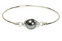 handmade sterling silver wire wrapped bangle bracelet with dark grey pearl by Jessica Luu Jewelry