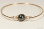 14K yellow gold filled wire wrapped bangle bracelet with black pearl handmade by Jessica Luu Jewelry