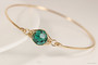 14k yellow gold filled wire wrapped bangle bracelet with emerald green crystal handmade by Jessica Luu Jewelry