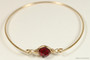 14k yellow gold filled wire wrapped bangle bracelet with garnet red siam crystal handmade by Jessica Luu Jewelry