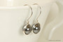 Sterling silver wire wrapped dark grey pearl drop earrings handmade by Jessica Luu Jewelry