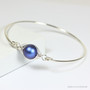 Sterling silver bangle bracelet with 10mm iridescent dark blue pearl solitaire handmade by Jessica Luu Jewelry
