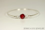 Sterling silver wire wrapped bangle bracelet with scarlet red crystal handmade by Jessica Luu Jewelry