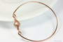 14K rose gold filled wire wrapped bangle bracelet with powder almond pearl handmade by Jessica Luu Jewelry