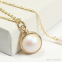 14K yellow gold filled wire wrapped pearlescent white pearl solitaire pendant on chain necklace handmade by Jessica Luu Jewelry