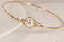 14k yellow gold filled wire wrapped bangle bracelet with white pearl handmade by Jessica Luu Jewelry