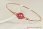 14k rose gold filled wire wrapped bangle bracelet with mulberry pink pearl handmade by Jessica Luu Jewelry