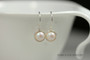Sterling silver wire wrapped pearlescent white pearl drop earrings handmade by Jessica Luu Jewelry