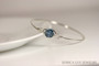 Sterling silver wire wrapped bangle bracelet with denim blue crystal handmade by Jessica Luu Jewelry
