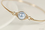 Handmade 14k yellow gold filled wire wrapped bangle bracelet with light blue pearl by Jessica Luu Jewelry