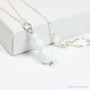 3 stone faceted round white alabaster gemstone pendant on sterling silver chain necklace handmade by Jessica Luu Jewelry