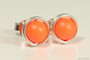 Sterling silver wire wrapped stud earrings with neon orange pearls handmade by Jessica Luu Jewelry