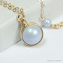 10mm powder blue pearl solitaire pendant in 14K yellow gold filled wire wrapped setting on 18 inch long chain necklace handmade by Jessica Luu Jewelry
