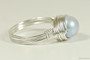 Sterling silver wire wrapped iridescent light dreamy blue pearl solitaire ring handmade by Jessica Luu Jewelry