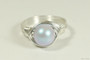 Sterling silver wire wrapped iridescent light dreamy blue pearl solitaire ring handmade by Jessica Luu Jewelry