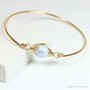 14K gold filled bangle bracelet with 10mm light blue pearl solitaire handmade by Jessica Luu Jewelry