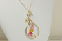 14K yellow gold filled wire wrapped paisley pendant on chain necklace with light rose, sunflower, and Indian pink crystals handmade by Jessica Luu Jewelry