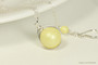 Sterling silver wire wrapped pastel yellow pearl solitaire necklace handmade by Jessica Luu Jewelry