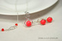 Sterling silver necklace and matching earrings with neon red pearl pendant handmade by Jessica Luu Jewelry