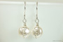 Sterling silver wire wrapped white flat coin pearl dangle earrings handmade by Jessica Luu Jewelry